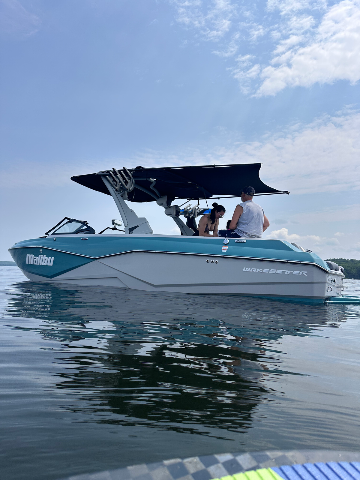 Malibu Wakesetter 25 LSV with a Shoreline Brands bimini extension adding shade behind the factory bimini