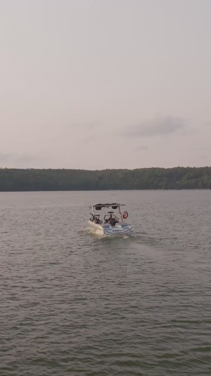 Video of a family having fun on a boat while under a Nautique G23 Telescoping Tower bimini extension